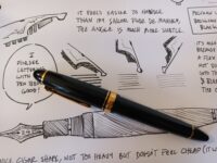 Photo of a Sailor Profit 1911, 21k fountain pen with it's cap on and sitting on top of a test page.